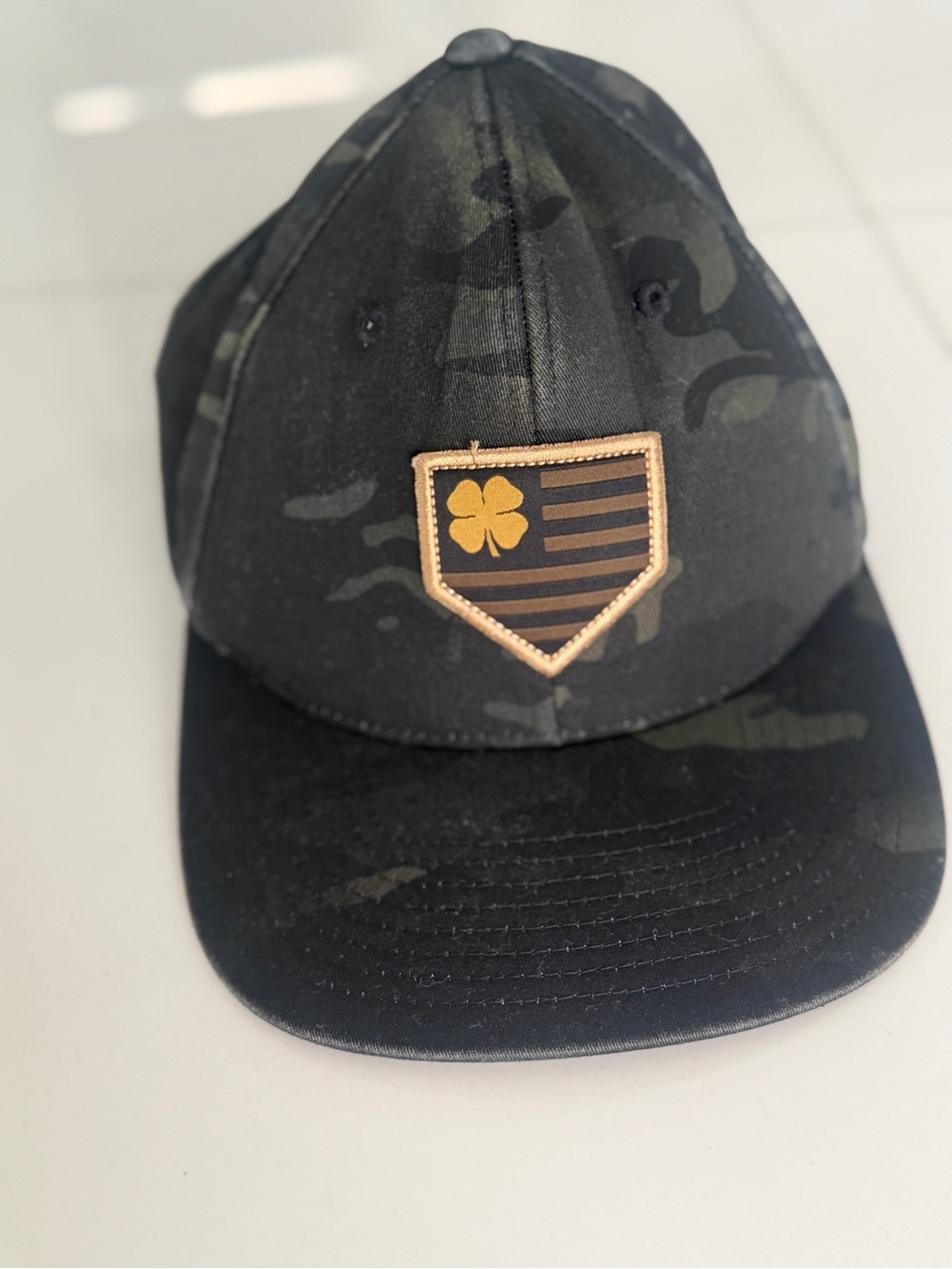 Rawlings Black Camo Cap with Gold Clover Shield Patch